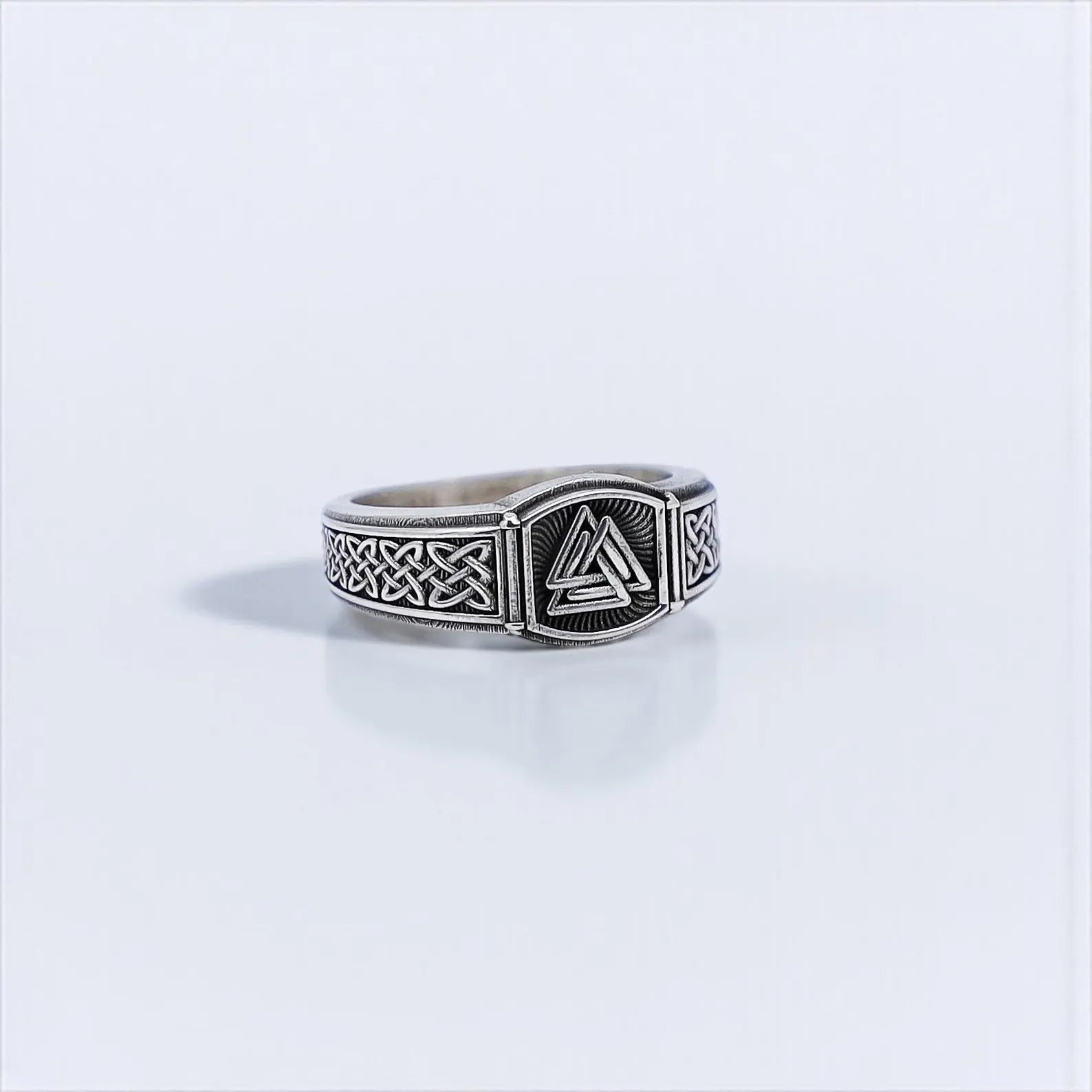 Stylish and symbolic handcrafted silver pinky ring with deep engravings of the Valknut trinity knot — often linked to courage, fate, and eternal power in Norse mythology — a meaningful gift for men who value history, craftsmanship, and heritage.