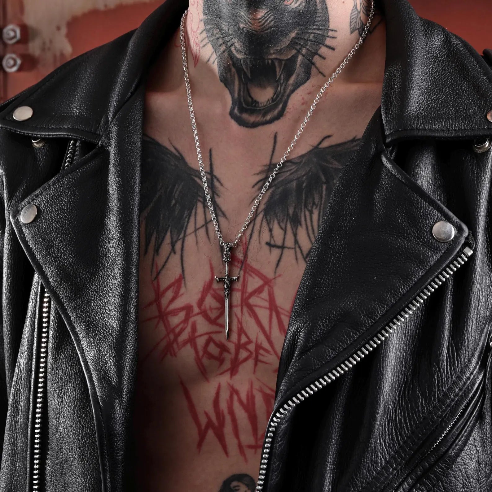 A handcrafted silver sword necklace designed to inspire the inner warrior. Made from high-quality 925K sterling silver, this pendant features refined textures and artisan detail that reflect a balance between gothic aesthetics and timeless medieval craftsmanship. Perfect for men seeking strength in symbolism and style.