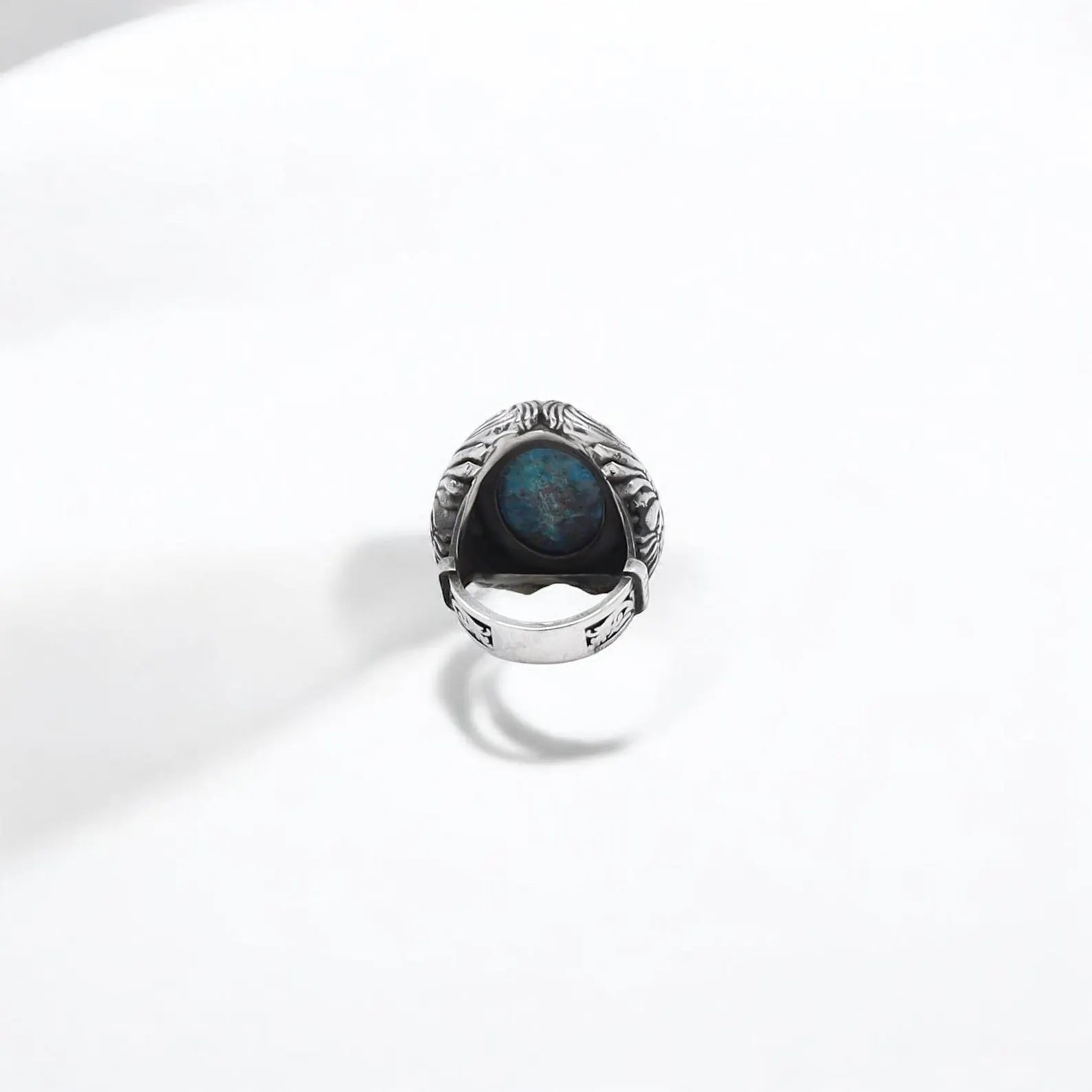 This large statement ring is crafted from 925 sterling silver and showcases a vivid turquoise gemstone with unique natural markings. The detailed metalwork evokes tribal and Western themes, making it a symbolic and fashionable piece for any man who values authentic, heritage-inspired jewelry.