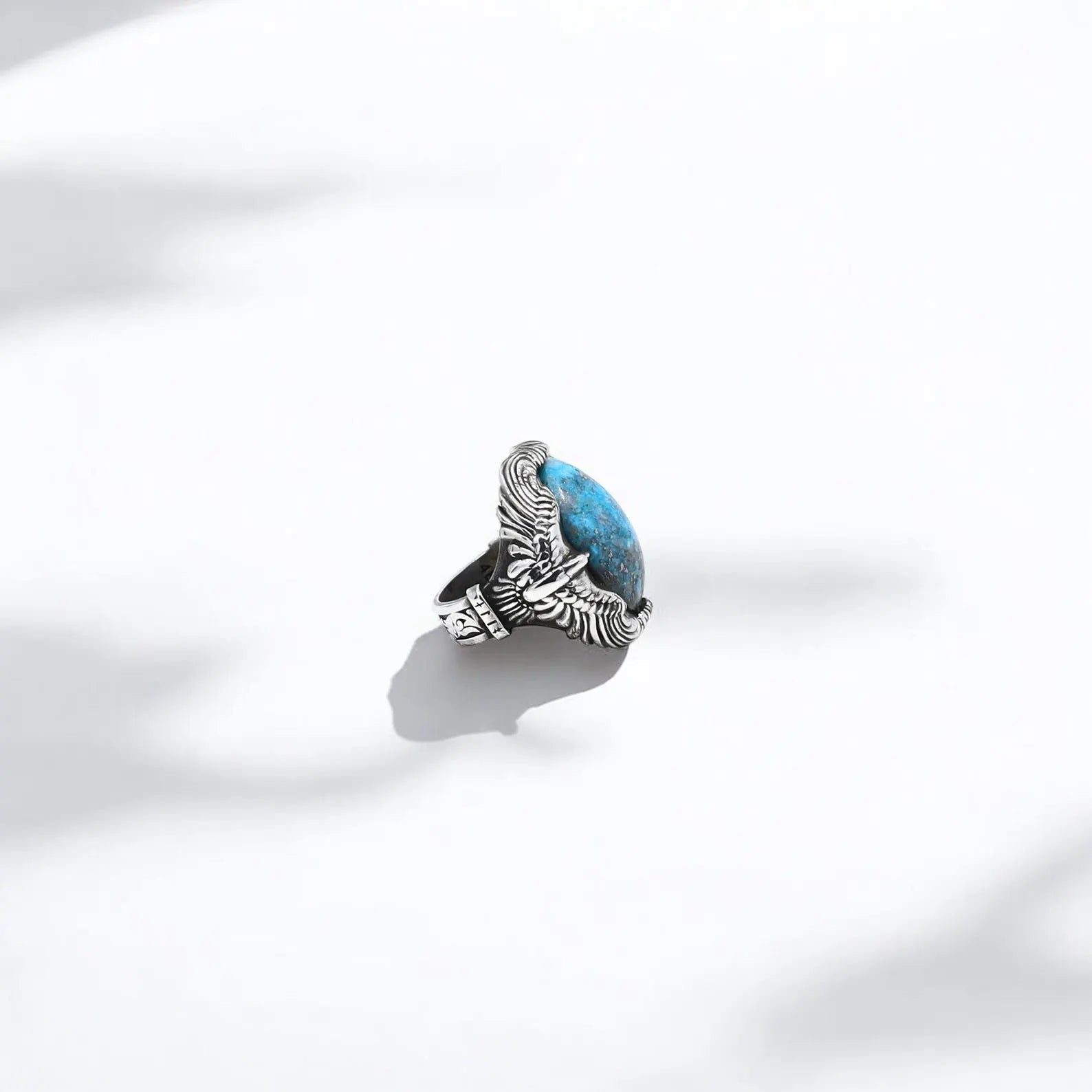 This artisan turquoise ring for men features a handcrafted 925 sterling silver band surrounding a polished, natural turquoise stone. The design reflects cowboy and Western aesthetics while embracing Native American symbolism. Perfect as a unique gift or a personalized keepsake with engraving options available.