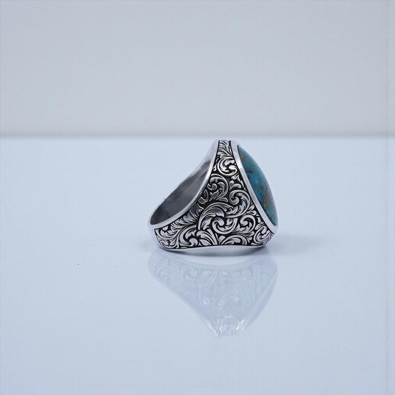 Vintage-inspired men’s signet ring made from 925 sterling silver, decorated with Baroque floral patterns and a vibrant natural turquoise stone