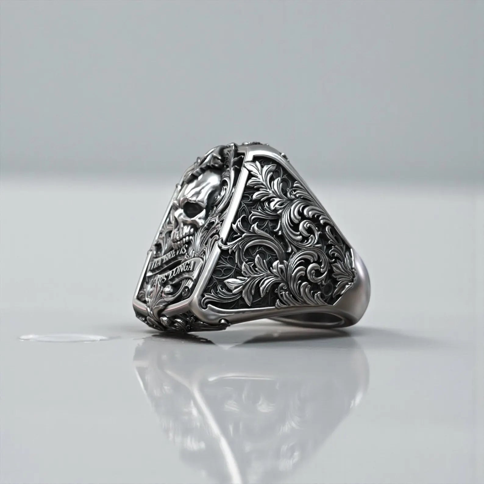 Handmade men’s gothic biker ring with jawless skull motif in oxidized sterling silver and detailed baroque engraving