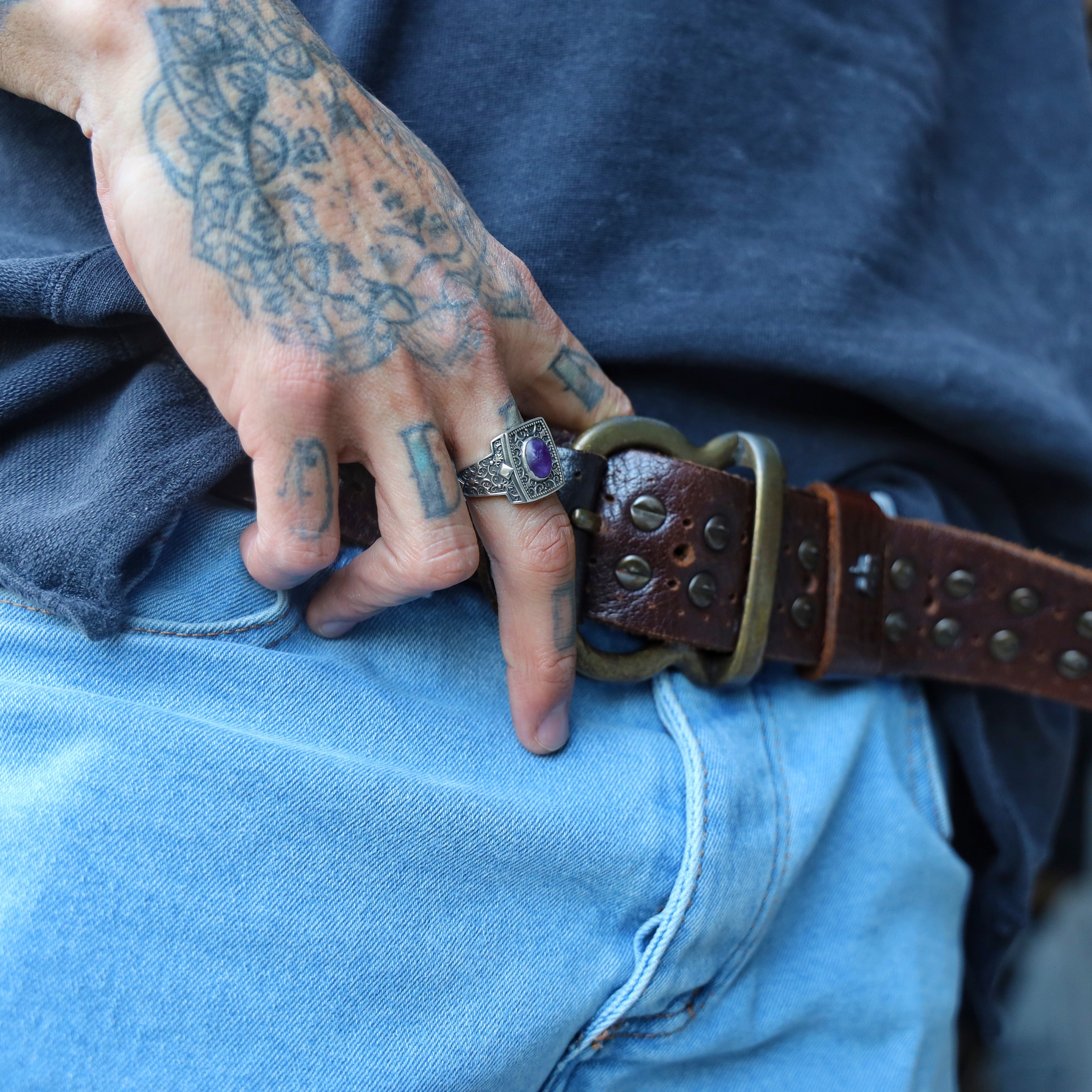 This vintage-inspired mens ring features a rich purple amethyst stone and bold silver engraving that captures attention at first glance. The combination of detailed ornamentation and gemstone energy makes it a standout piece for bohemian men, mystics, or those who love antique-style masculine jewelry. It can be personalized on the inside for added sentimental value, transforming it into a meaningful and lasting gift.
