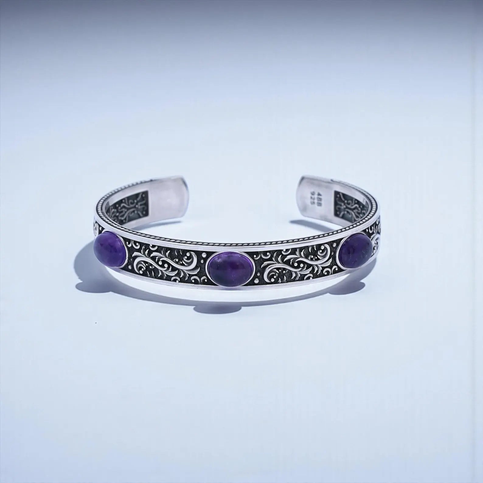 Handcrafted 925 sterling silver amethyst cuff bracelet for men featuring three natural purple amethyst stones set into a vintage-engraved, oxidized silver band. This bold unisex statement bracelet symbolizes balance and protection, making it an ideal personalized gift for Christmas, anniversaries, or birthdays.