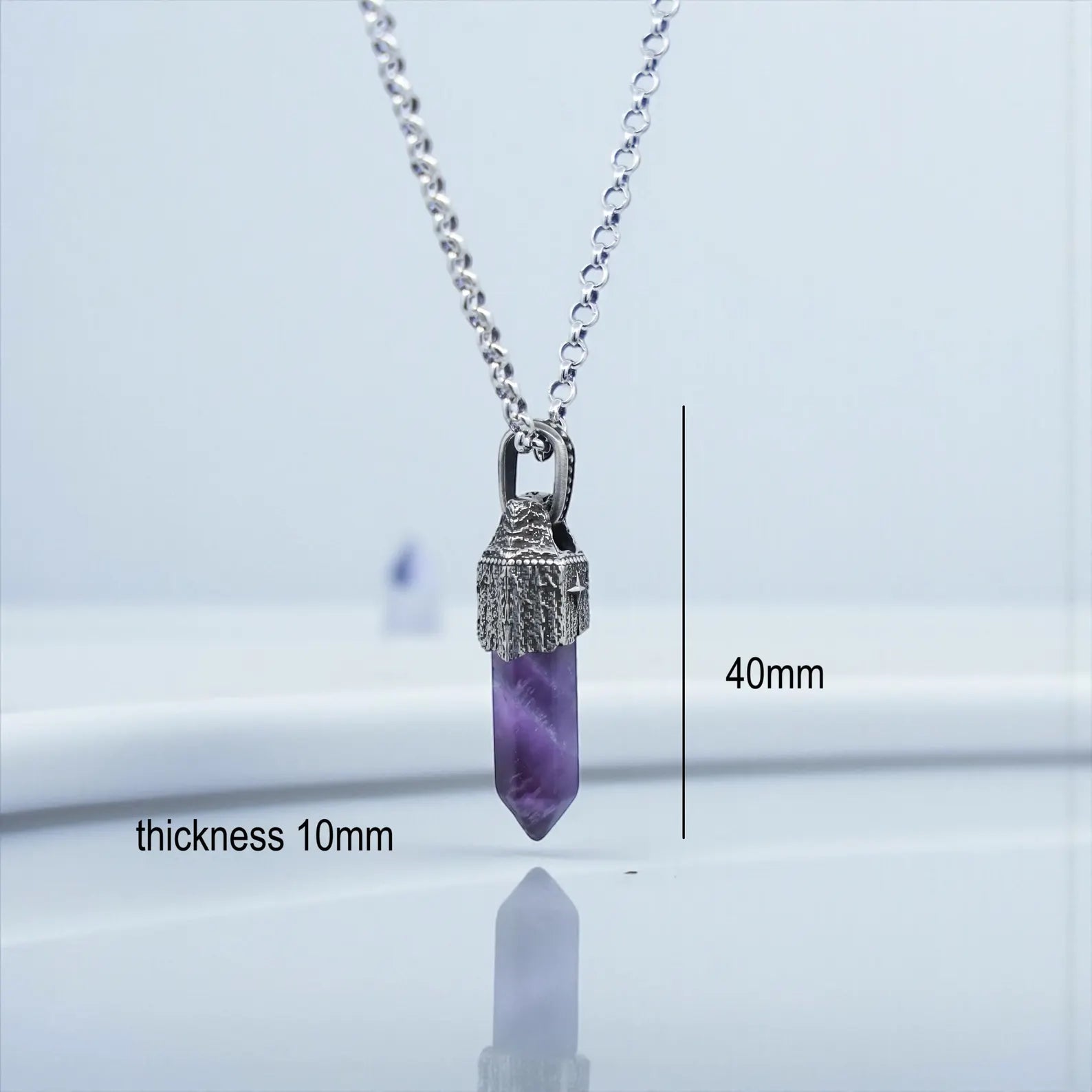 Detailed macro photo of a vintage-style sterling silver amethyst pendant, highlighting the handcrafted oxidized finish, natural gemstone brilliance, and elegant masculine nautical-inspired design.