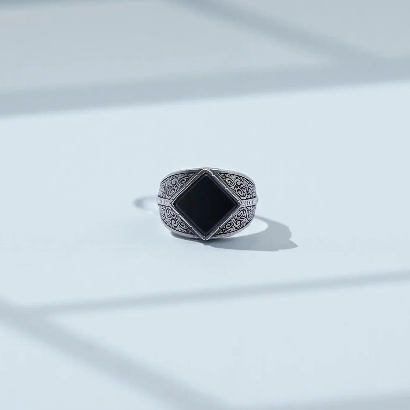 Vintage black onyx signet ring for men photographed on a clean background, showcasing the handcrafted 925 sterling silver baroque engravings and the polished 10x10 natural onyx stone, perfect for SEO searches like “onyx ring men” and “personalized silver signet ring.