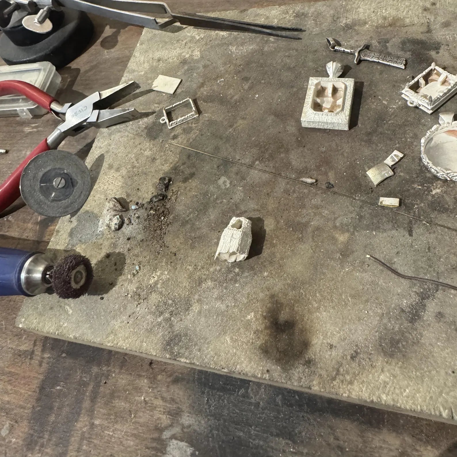 Detailed image of a handcrafted sterling silver pendant for men with natural black obsidian point stone, bold compass detail, textured oxidized finish, and vintage talisman aesthetic symbolizing protection and strength.