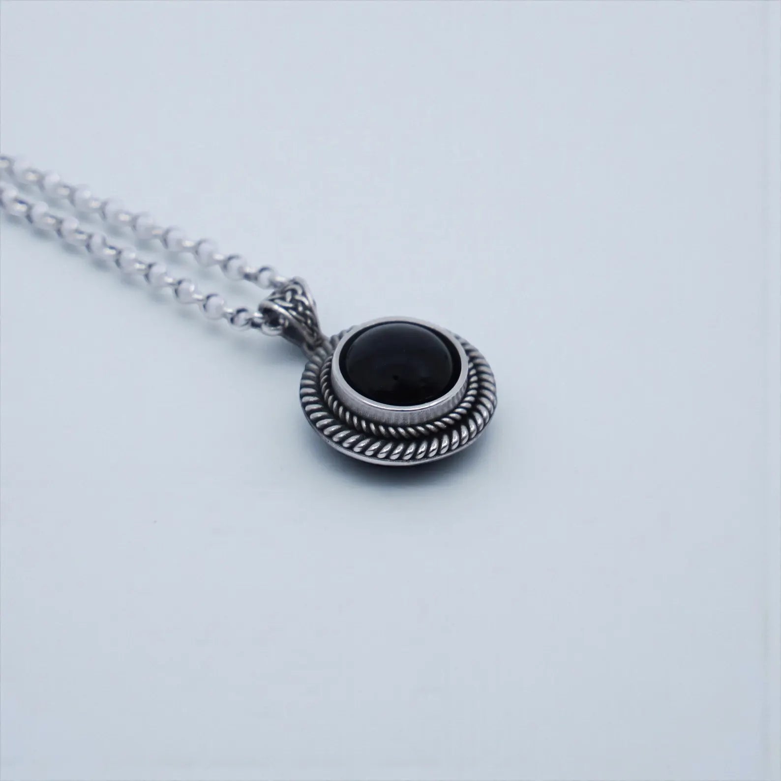 Artisan-made vintage rope pendant necklace with natural black onyx stone for men, designed in solid 925 sterling silver, offering a masculine, timeless, and statement look suitable for everyday wear and special occasions.