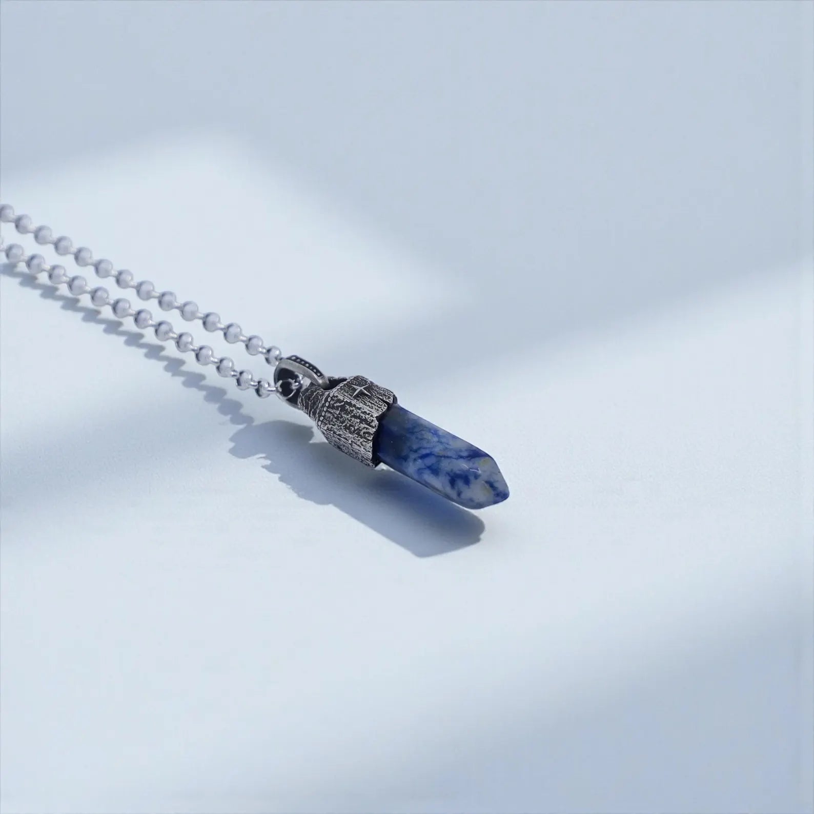 Vintage-inspired compass pendant necklace with natural blue sodalite crystal, handcrafted in oxidized 925 silver to create a spiritual talisman symbolizing protection, clarity, emotional harmony and timeless masculine charisma — perfect for Christmas or anniversary gifts.