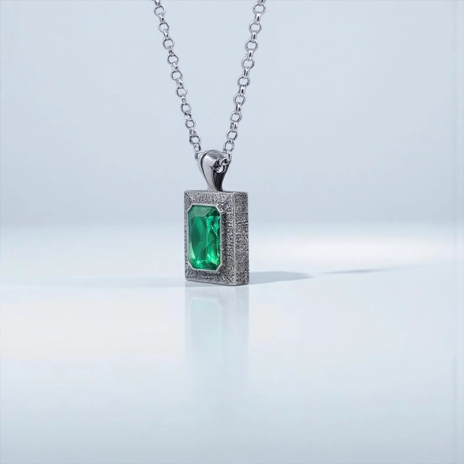 Chunky emerald gemstone pendant necklace for men, featuring a handcrafted 34mm tall sterling silver pendant with deep green cubic zirconia, ideal for birthdays, Valentine’s Day, and luxury gift occasions.