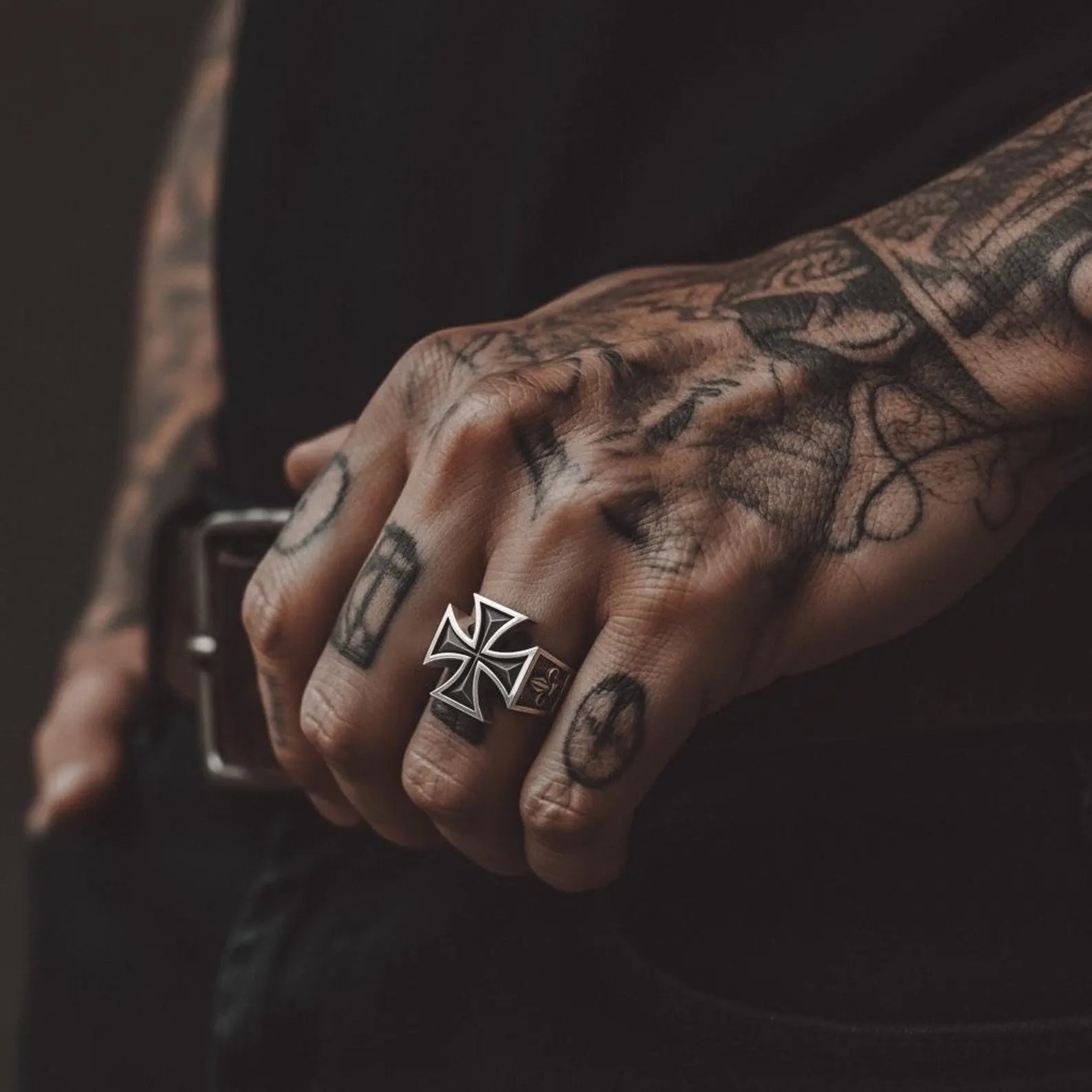 Gothic Maltese Cross signet ring for men photographed in studio lighting, emphasizing the rugged sterling silver craftsmanship and powerful faith-inspired symbol.