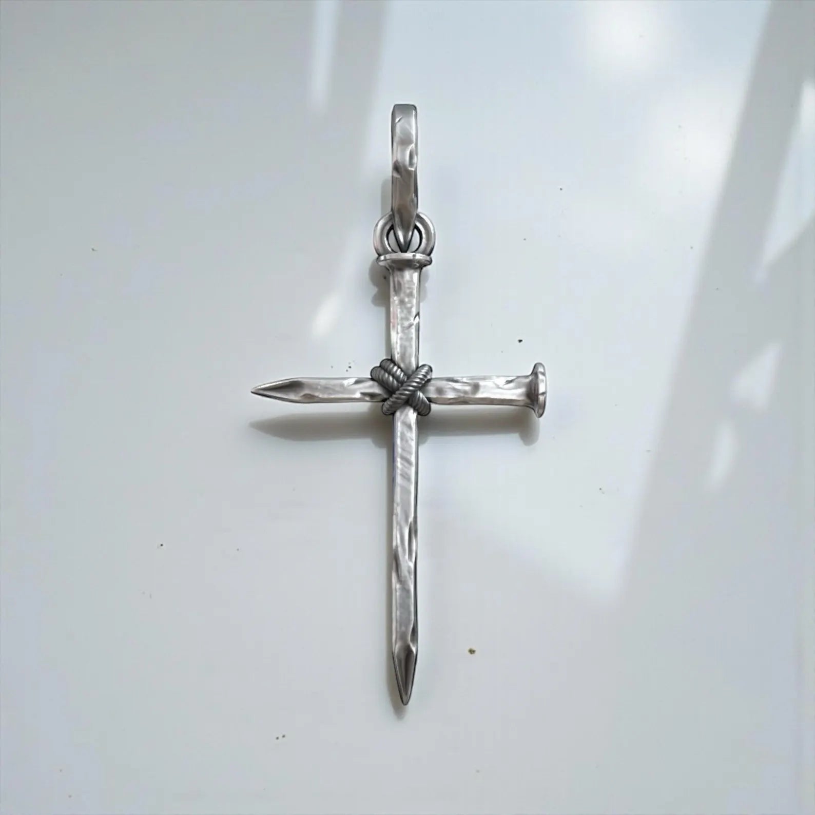 Sterling silver Christian nail cross jewelry for men featuring a strong symbolic design, oxidized silver texture, and handcrafted artisanal quality.