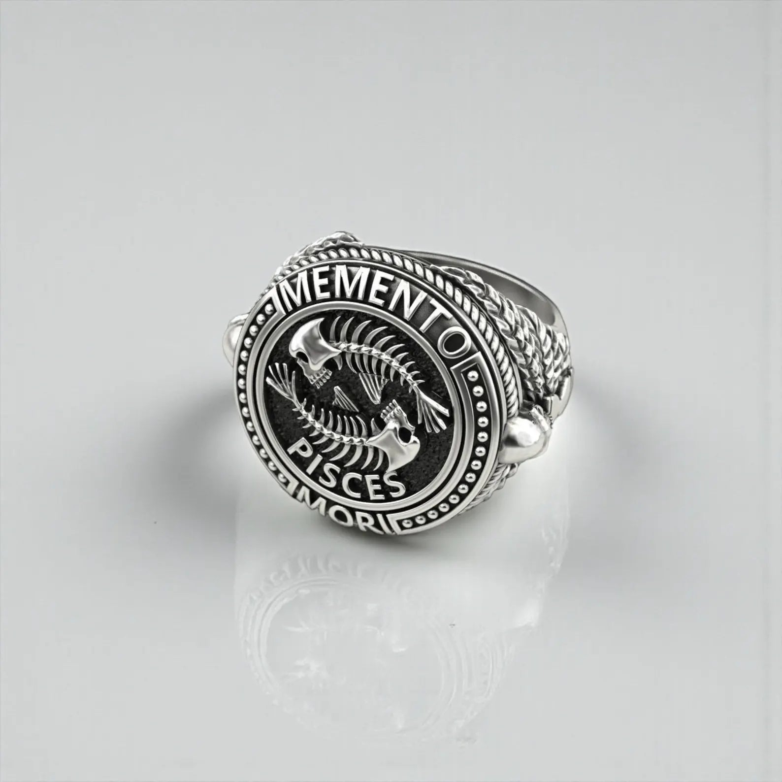 Handcrafted Pisces zodiac ring in sterling silver, symbolizing duality, mortality, wisdom, and spiritual depth through powerful Memento Mori imagery.