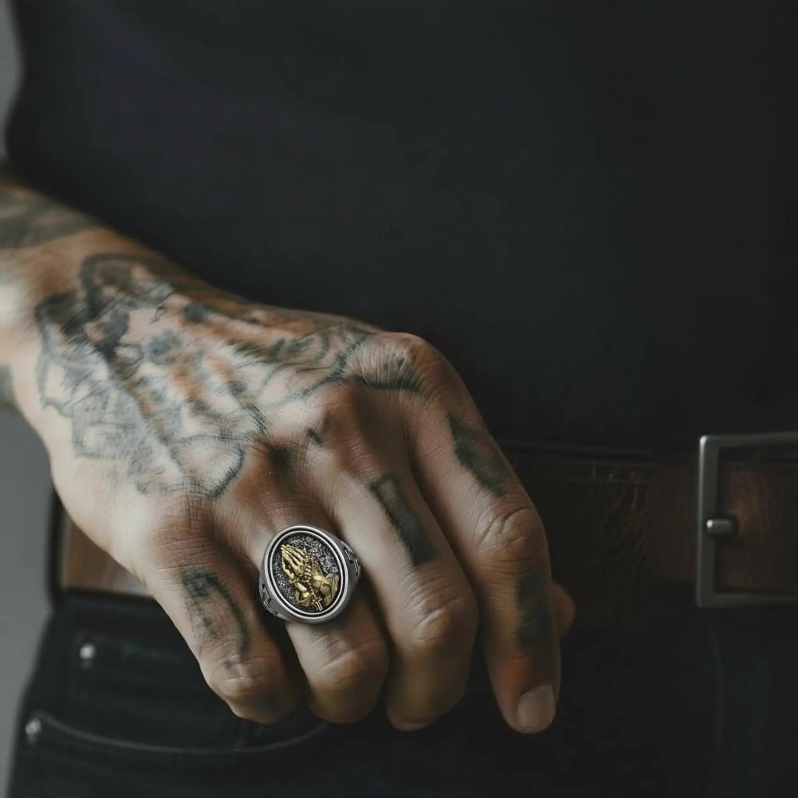 Sterling silver praying hands rosary cross ring with gold detail, symbolizing Christian devotion, prayer, protection, and spiritual strength in a handcrafted religious statement ring