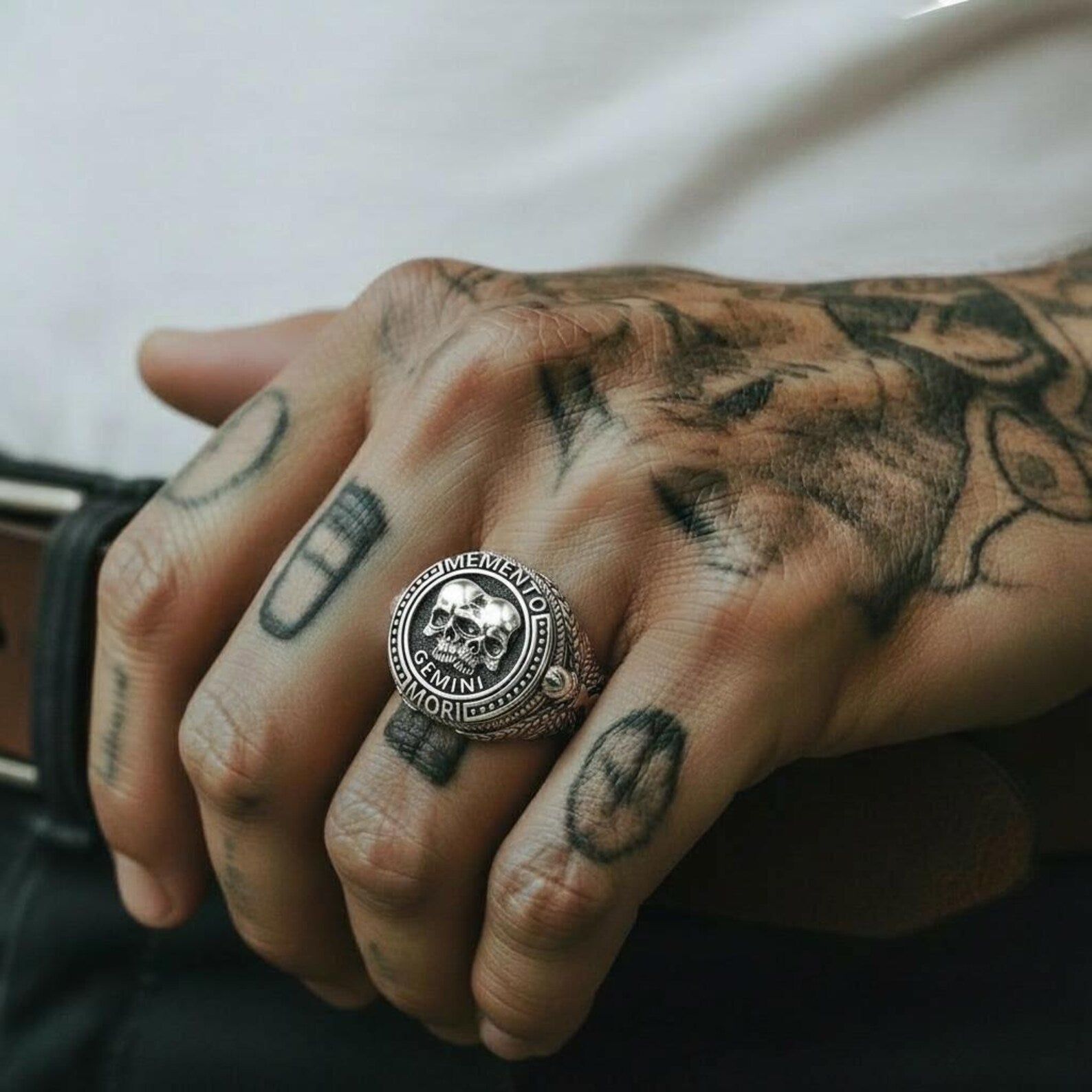 Artisan-crafted Gemini Skull Ring in solid sterling silver designed with symbolic twin skulls that reflect themes of life, balance, and transformation, offering a distinctive gothic aesthetic and exceptional handcrafted detail for statement jewelry collectors.