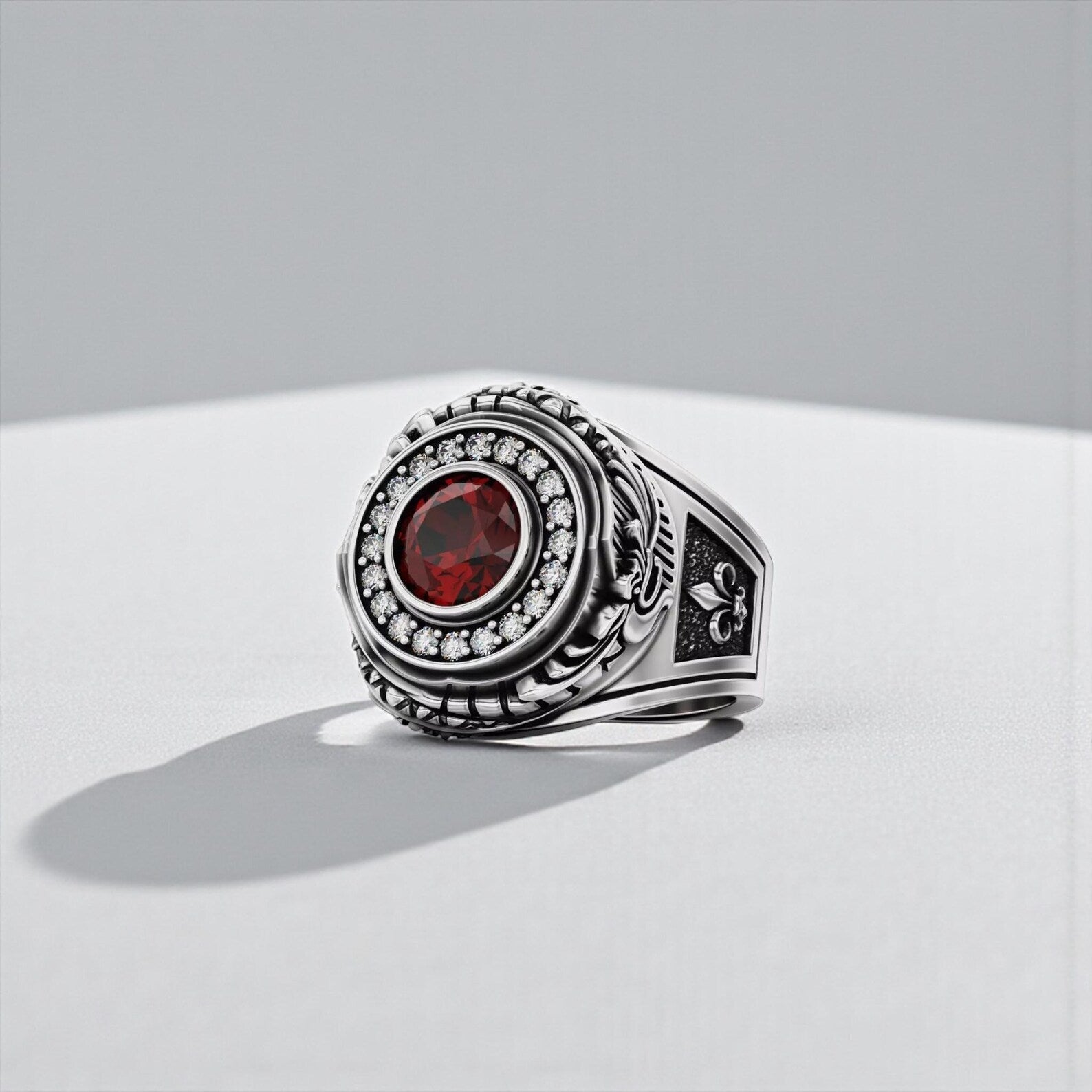 Men’s sterling silver Ouroboros ring featuring a vivid red garnet stone, gothic symbolic jewelry piece representing rebirth, protection, and eternal power.