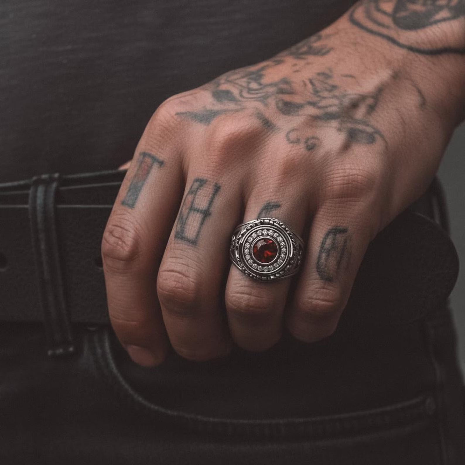 Side angle of a bold Ouroboros snake ring for men, handmade from 925 sterling silver with textured serpent scales and deep oxidized contrast for a dark gothic aesthetic.
