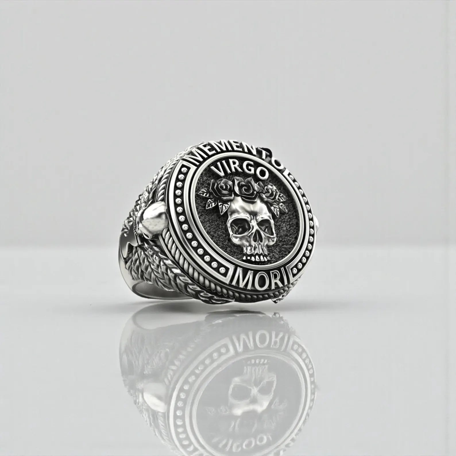 Detailed view of a Memento Mori Virgo ring highlighting the skull and rose centerpiece, oxidized silver finish, and bold gothic biker style jewelry design.