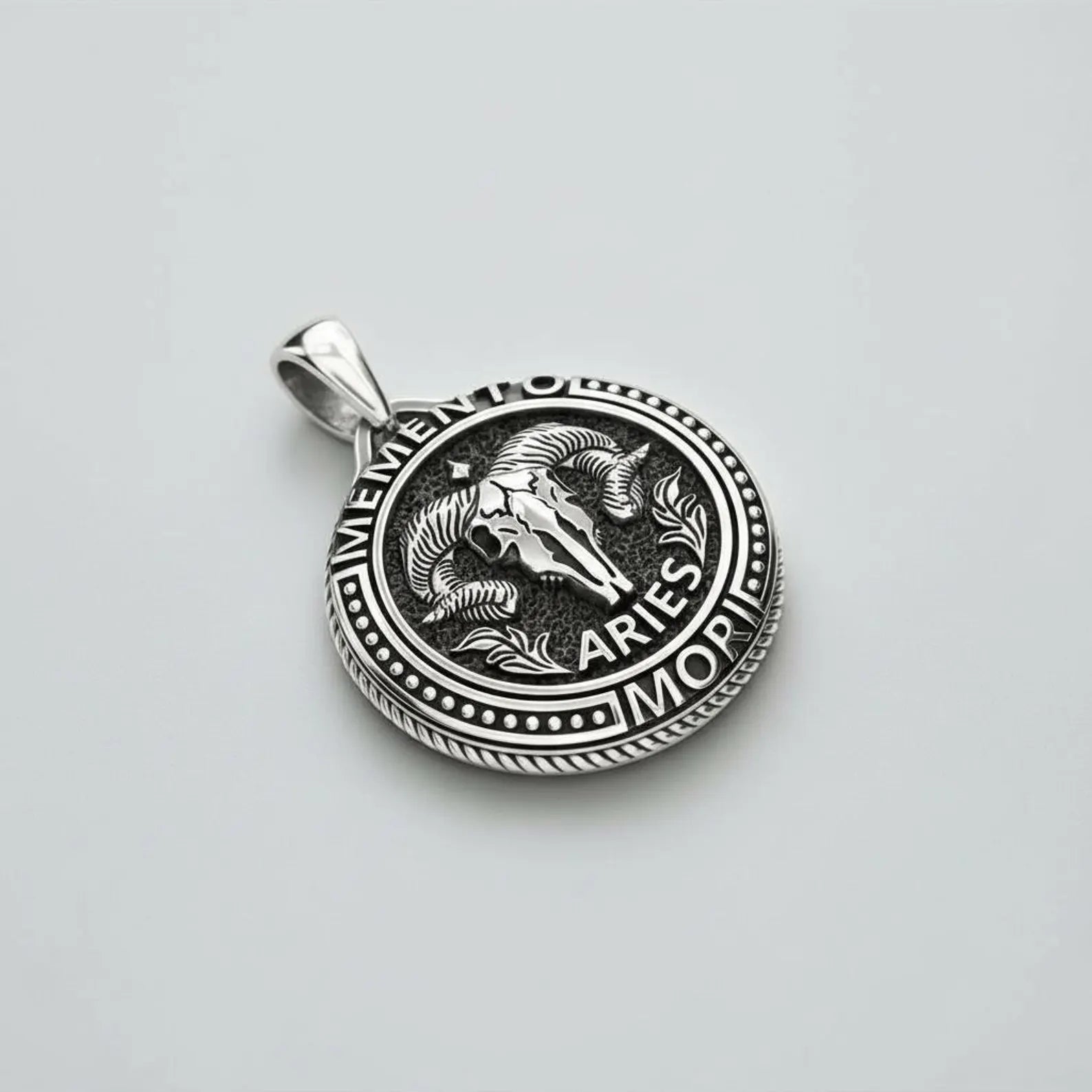 Memento Mori Aries goat pendant necklace made of high-quality sterling silver, gothic zodiac jewelry representing passion, determination, warrior spirit, and life’s impermanence.