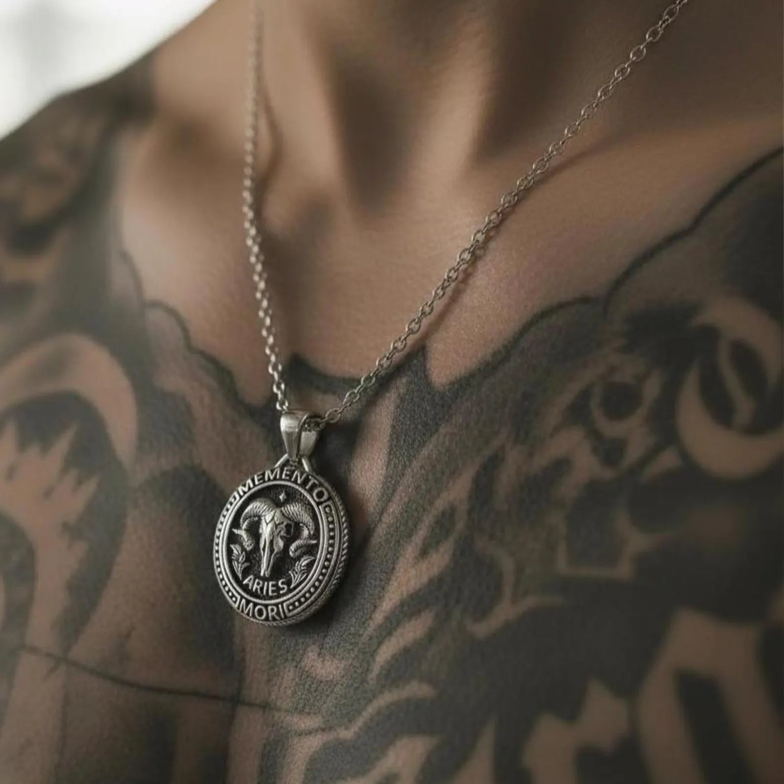 Sterling silver Gothic Aries necklace with Memento Mori goat pendant, handcrafted statement jewelry symbolizing courage, leadership, inner fire, and astrological identity.