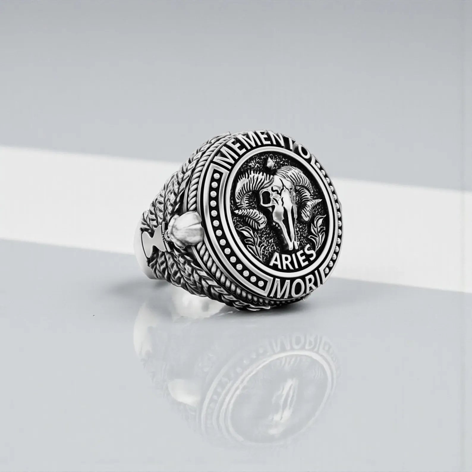 Close-up view of Aries ram skull ring for men, handmade 925 silver statement ring with detailed engravings and dark oxidized contrast