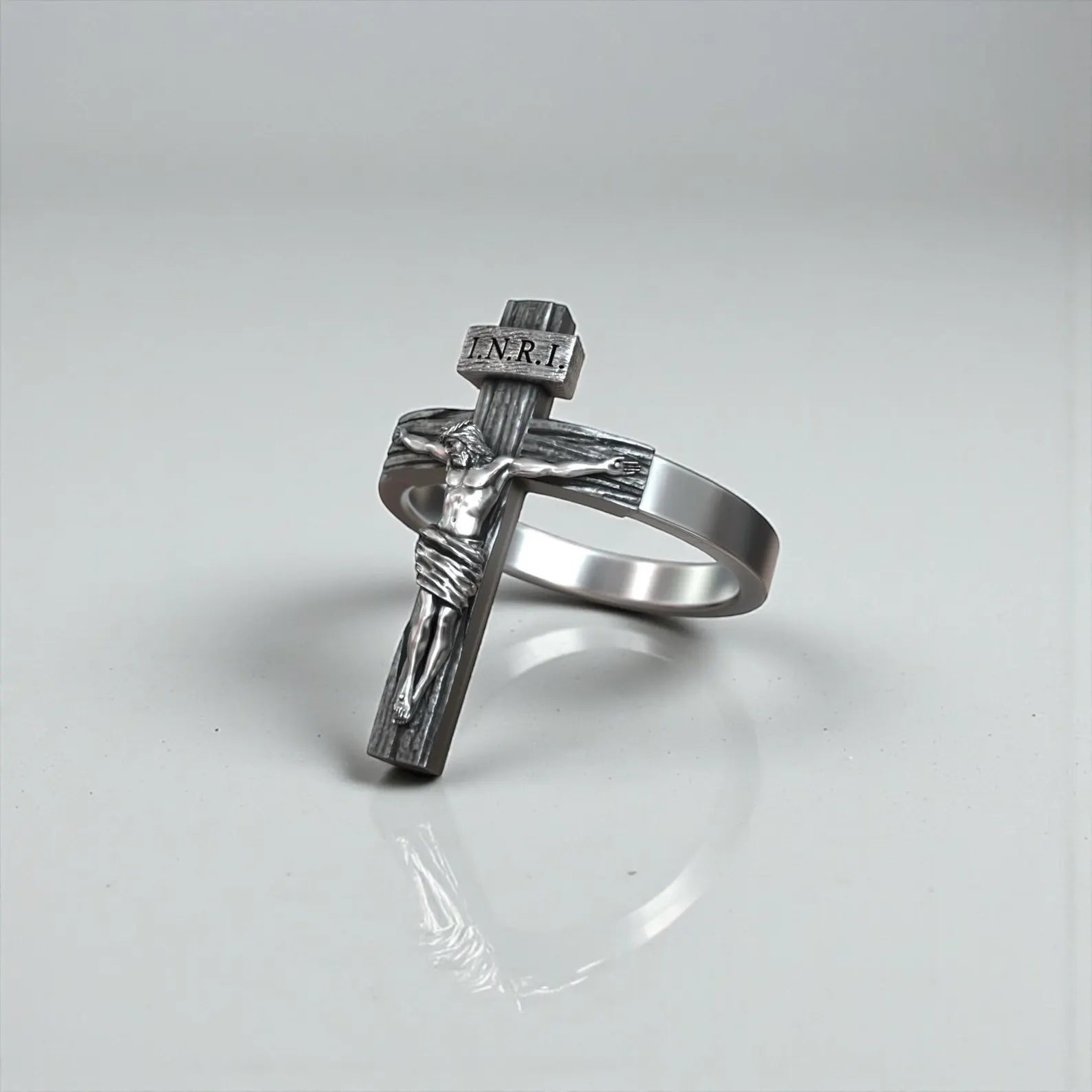 Religious sterling silver crucifix ring featuring Jesus Christ cross design, handcrafted sacred jewelry with oxidized finish for spiritual expression and timeless masculine style